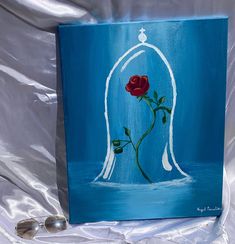 Red rose inside of a bell acrylic painting. beautiful for any room in the house. Message me for custom paintings! Cool Paintings For Bedroom, Sailor Moon Acrylic Painting, Spiritual Paintings Easy Aesthetic, Heartfelt Paintings, Metallic Acrylic Painting Ideas, Kehlani Painting, Rose Painting Ideas, Painting Ideas On Canvas Red, Mom Canvas Painting