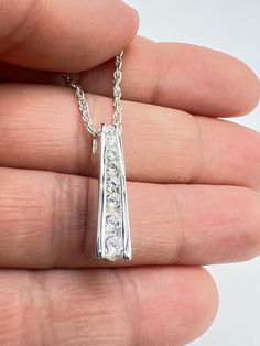 Beautiful urn necklace, 925 sterling silver, a beautiful way to keep the memory of a loved one or beloved pet's ashes/hair. ♥️FreePersonalization:Can be engraved on the back 12 characters maximum. ♥️Gift box included; Funnel kit included; ♥️Care Instructions Even though the materials used are made of sterling silver, I recommend you to not sleep, swim, or spray chemicals (i.e. perfumes, lotions, or body spray) on to the necklace to preserve its longevity. Please follow these tips to preserve the longevity of the necklace. To clean, it is best to use a soft microfiber cloth to clean the jewelry from smudges. ✿ Questions & Concerns ?  Have any questions? Please do not hesitate to send me a message with further questions and concerns. I will be more than happy to assist you! :) Thank you for Classic Silver Necklace With Channel Set, Classic Silver Necklace Channel Set, Classic Silver Channel Set Necklace, White Gold Rectangular Pendant Jewelry For Anniversary, Anniversary Jewelry With Rectangular Polished Pendant, Sterling Silver Rectangular Pendant For Anniversary, Gift White Gold Channel Set Jewelry, Silver Hypoallergenic Jewelry For Keepsake, Elegant Sterling Silver Jewelry For Memorial