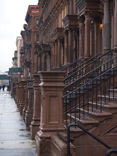 a row of stone buildings on a city street