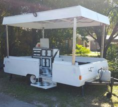 an old white truck with a black and white checkered floor