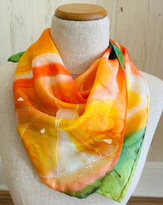 "Silk orange hair scarf, fruit silk neck scarf, hand-made silk scarf women, vintage  silk scarf orange yellow green, hand painted silk scarf Hand-painted scarf -  Orange - the flavor color is orange MATERIALS:  painting on silk SIZE painting: 22″x22″ CREATION DATE: 2022 Why are my scarves \"imperfect\"? 1. They are not always square, they may be slightly rectangular 2. They are not always double-sided 3. They - and this is the most important thing - are painted not according to the canons of scarves, but more like paintings. But! They are always individual, they are always about YOU and for YOU. What is your favorite flower? Which one resonates the most for you? Do you wonder why? Do you know what do flowers say? With the magic of flowers, you can manifest your every desire, and what is mo Artistic Hand Painted Green Silk Scarf, Elegant Orange Silk Scarf, High-end Yellow Silk Scarf For Summer, Vibrant Silk Scarf, Silk Neck Scarf, Artistic Hand-dyed Green Scarves, Painted Scarf, Vintage Silk Scarf, Silk Scarf Painting