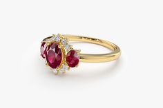 "Ruby Ring / 14k Three Stone Natural Ruby Cluster Ring / Classic Genuine Ruby Engagement Ring 14k Gold / July Birthstone / Promise Ring Features *Made to Order *Gold Kt: 14K (also available in 18K) *Available Gold Color: Rose Gold, Yellow Gold, White Gold *Oval Shape Ruby: 1 pc 6 x 4MM *Oval Shape Ruby: 2 pc 4x3MM *Round Diamonds: 10 pcs 1.55 MM *Ruby CTW: 1.23 ctw *Diamond CTW: 0.16 ctw *Ready to Ship in 7-10 Business Days If you have any additional questions about this product, just hit the \" 14k Gold Cluster Ring With Accent Stones For Anniversary, Anniversary 14k Gold Cluster Ring With Accent Stones, 14k Yellow Gold Cluster Ring With Accent Stones, Yellow Gold Cluster Ring With Accent Stones, 14k Gold Gemstone Cluster Ring For Anniversary, Yellow Gold Cluster Ring With Accent Stones For Promise, Anniversary Yellow Gold Cluster Ring With Accent Stones, Classic Three Stone Ruby Ring In 14k Gold, Three Stone Ruby Ring In 14k Yellow Gold