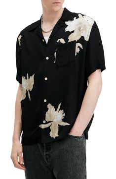 A nod to retro island styles, this camp shirt sports a grandly scaled floral print against a light, breezy fabric that feels good on a tropical day. 28 1/2" length; 46" chest (size Medium) Front button closure Convertible collar Short sleeves Chest patch pocket 100% viscose Machine wash, tumble dry Imported Lounge Sweater, Convertible Collar, Jo Malone London, Evening Formal, Camp Shirt, Island Style, Back To Nature, Camping Shirt, Matching Dresses