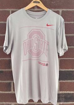 Show off your team pride in this Ohio State Buckeyes Grey Sideline Team Issue Short Sleeve T Shirt! This The Ohio State University Short Sleeve Tee features a need to update. Make sure everyone knows you root for the Buckeyes with this Grey The Ohio State University T Shirt. Go Buckeyes! University Tshirt, The Ohio State University, Ohio State University, Ohio State Buckeyes, Short Sleeve T Shirt, Nike Shirts, Ohio State, State University, Ohio