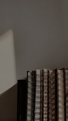 a stack of books sitting on top of a desk