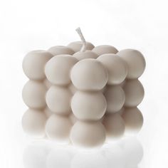 a bunch of white grapes sitting on top of a table