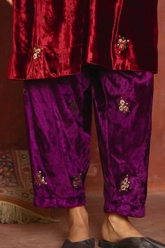 Red kurta in velvet with patchwork and delicate hand embroidery. Comes with purple velvet salwar. 
 - Aza Fashions Designer Velvet Kurta With Mirror Work, Designer Velvet Traditional Wear For Diwali, Diwali Designer Velvet Traditional Wear, Diwali Velvet Kurta With Mirror Work, Festive Velvet Traditional Wear With Traditional Drape, Festive Velvet Traditional Wear, Velvet Kurta With Mirror Work And Traditional Drape, Festive Velvet Kurta With Zari Work, Designer Velvet Traditional Wear With Pallu