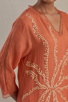 Orange kaftan hand embroidered with flower motif, asymmetric hem and sheer scalloped border detailing on neck and cuffs. Paired with a flared pant with sheer border on hem and contrasting line on sides. - Aza Fashions Orange Kaftan, Kaftan Set, Hand Embroidered Flower, Scalloped Border, Kimono Fabric, Flower Motif, Pants Pattern, Set For Women, Embroidered Flowers