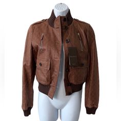 Authentic Gucci Gg Guccissma Leather Bomber Jacket Nwt- New Size 42 (Fits Like A Small Us 4-6) See Measurements Button Up Closure Knit Sweater Trim- 84% Cotton 12% Nylon 4% Elastane 6 Front Pockets Shoulder Epaulettes Material: 100% Leather Lining 100% Cotton Aprx Flat Measurements: Chest : 20" Waist 16.5" Length: 20" Sleeve: 25.5" From Shoulder Kept In Clean, Smoke-Free, Pet-Free Home Jacket Can Use A Conditioning, It Sat In The Closet Without Being Worn For Years. See Pics Of Color Distress Re Gucci Brown Outerwear With Pockets, Brown Gucci Outerwear With Pockets, Elegant Brown Gucci Outerwear, Gucci Designer Leather Outerwear, Gucci Fitted Leather Jacket For Fall, Designer Leather Gucci Outerwear, Designer Gucci Leather Outerwear, Luxury Gucci Outerwear For Fall, Designer Gucci Leather Jacket With Long Sleeves