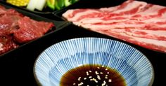 some meats and other food items on a table