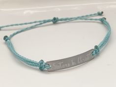 "This is an engraved waterproof bracelet, It is shown with an engraved brushed stainless steel bar and mint straps. You can choose your metal color and strap color. The bar will be engraved with \"Sisters in Christ\". You can choose back side engraving for personalization during checkout. Please let us know if you have any questions! The back can also be engraved. CHARACTER LIMIT- 14 characters per side Each item is made-to-order, which gives our pieces a unique meaning that is specific and spec Adjustable Stainless Steel Bracelet With Laser Engraving, Adjustable Engraved Name Bracelet For Friendship, Adjustable Stainless Steel Name Bracelet For Everyday Wear, Adjustable Stainless Steel Name Bracelet For Everyday, Adjustable Stainless Steel Bracelets With Engraved Text, Adjustable Stainless Steel Bracelet With Engraved Text, Adjustable Name Bracelet With Engraved Text As Gift, Adjustable Silver Name Bracelet With Engraved Text, Inspirational Engraved Adjustable Name Bracelet