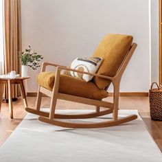 a rocking chair in the corner of a living room