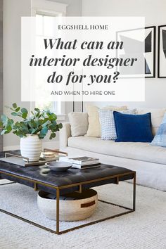 a living room with white couches and blue throw pillows on the coffee table is featured in an article titled what can an interior designer do for you?