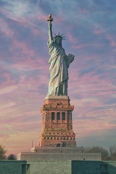 the statue of liberty in front of a pink sky with words that read see the state of liberty