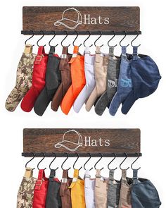 there are many pairs of socks hanging on the hooks in front of this sign that says hats