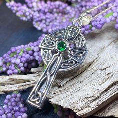 Solid sterling silver Celtic Cross Pendant with emerald cubic zirconia on your choice of chain length This beautiful solid sterling silver Celtic Cross incorporates the Celtic knot work in a lovely classic Celtic weave design...a unique piece that will be loved for a lifetime. 1 1/2" x 3/4" solid sterling silver pendant comes on a sterling silver chain. Hallmarked 925 on back of pendant. History of Celtic Knot Work The use of knot work design is a practice that began early in human history. In t Formal Sterling Silver Hallmarked Emerald Necklace, Formal Hallmarked Sterling Silver Emerald Necklace, Formal Sterling Silver Emerald Necklace, Formal Hallmarked Emerald Necklace In Sterling Silver, Symbolic May Birthstone Jewelry As Gift, Silver Emerald Pendant Necklace As Gift, Sterling Silver Cross Pendant Gift, Sterling Silver Cross Pendant Jewelry Gift, Classic Silver Necklace With Emerald