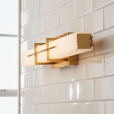 a bathroom light that is on the wall