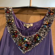 This Is Nwts Womens Hannah Jo Sleeveless Top, Size Large Color Blue(Looks Like A Periwinkle) . Has Tags And Bag Of Extra Beads. Please See Pictures For More Details And Measurements. Make Me An Offer! Bundle 4 Items For Free Shipping And 15% Off! Multicolor Sleeveless Sequined Top, Multicolor Sequined Sleeveless Top, Bohemian Sleeveless Beaded Tops, Bohemian Beaded Sleeveless Top, Embellished Tank Top For Summer, Casual Embellished Tank Top For Spring, Embellished Sleeveless Tops For Spring, Sleeveless Embellished Tops For Spring, Purple Embellished Sleeveless Top