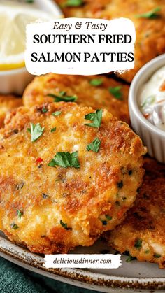 two fried salmon patties on a plate with ranch dip