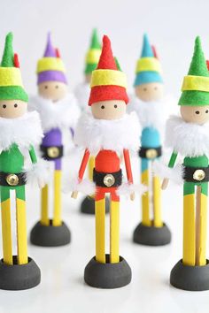 small wooden toy figurines are lined up