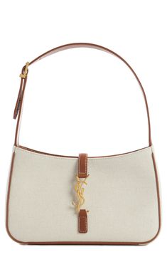 A slim, structured silhouette ensures this canvas bag fits perfectly under the arm. Hook tab closure Adjustable shoulder strap Structured silhouette with flat base for stability Textile with leather trim Made in Italy Designer Handbags Light Luxury Shoulder Bag With Adjustable Strap, Light Luxury Leather Shoulder Bag, Luxury High-end Shoulder Bag, Luxury Beige Summer Shoulder Bag, Cute Designer Bags, Ysl Bag Aesthetic, Trendy Designer Bags, Cute Shoulder Bags