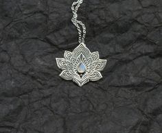 Lotus Necklace  Water Lily Necklace  Silver Lotus by spaceweaver Spiritual Engraved Moonstone Necklaces, Spiritual Engraved Moonstone Necklace, Engraved Moonstone Necklace For Spiritual Style, Engraved Moonstone Pendant Necklace, Silver Engraved Moonstone Necklace, Engraved Silver Moonstone Necklace, Symbolic Silver Moonstone Necklaces, Silver Moonstone Necklace With Symbolic Style, Artisan Silver Moonstone Jewelry