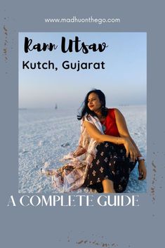 a woman sitting on top of a sandy beach next to the words ram utsav kutch, gularat