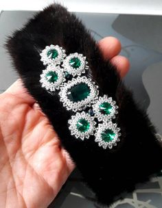 "Unique must have winter accessory - fur bracelet! This bracelet will be luxury Birthday gift for her, beautiful as Thank You gift for beloved wife or for mom, for sister, for daughter, Christmas gift - gift for her* This fur bracelet is handcrafted using genuine black mink fur, bead embroidered using emerald Swarovski crystals and Japanese seed beads and attached to silver leather.  * The bracelet is 5cm wide and 14.5cm lenght, it has lobster clasp and 5cm extention. READY TO SHIP! GIFT PACKED! Custom orders are welcome! Please, remember - all of my work is unique! If you want something that is sold already and is in the shop as an illustrative example (\"Made to order\"), I can make it for you - your jewelry will be very similar, but not exactly the same as the example seen in the shop. Luxury Handmade Party Bracelets, Elegant Jewelry For Anniversary In Winter, Luxury Handmade Party Bracelet, Luxury Handmade Bracelets For Anniversary, Fur Bracelet, Fur Necklace, Winter Bracelet, Luxury Birthday Gifts, Luxury Birthday