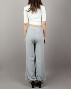 * Beautiful pearl chiffon pants, very comfortable to wear, not easy to get wrinkled, very easy to take care of. * Add an asymmetric layer on the front, very unique and beautiful. * Material: outer-pearl chiffon, lining-100% polyester Custom made to fit, lead time is 6-8 days; Let us know your usual size in your country and your overall height. If you have some specific request or special characters such as broad shoulder, long arms, long waist, etc you think we need pay attention to when making, Rayon Wide Leg Pants With Elastic Waistband, Flowy Bottoms With Elastic Waistband For Loungewear, Flowy Skirt Bottoms With Elastic Waistband For Loungewear, Stretch Rayon Wide Leg Pants With Elastic Waistband, Casual Solid Chiffon Bottoms, Casual Flowy Wide Leg Bottoms, Flowy Summer Pants With Elastic Waistband, Summer Stretch Rayon Wide Leg Pants, Casual Chiffon Trousers