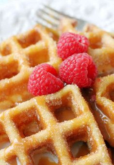 waffles with raspberries and syrup on a plate