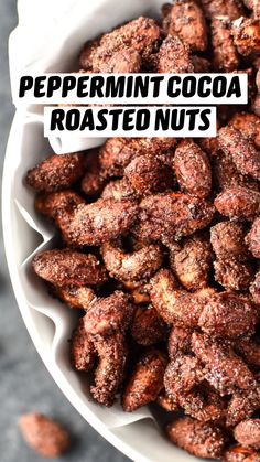 a white bowl filled with nuts on top of a table