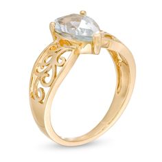 She'll be proud to wear this ravishing gemstone ring. Crafted in warm 10K gold, this unforgettable design showcases a 10.0 x 7.0mm pear-shaped icy-blue aquamarine solitaire centered on a sculpted filigree-detailed shank. Buffed to a brilliant luster, this ring is a fabulous choice she won't be able to resist. Elegant Pear-shaped Yellow Gold Birthstone Ring, Elegant Teardrop Birthstone Promise Ring, Elegant Pear-shaped Birthstone Promise Ring, Elegant Pear-shaped Birthstone Ring, Fine Jewelry Pear-shaped Topaz Ring For Anniversary, Teardrop Topaz Ring In Yellow Gold For Wedding, Fine Jewelry Yellow Gold Topaz Ring With Teardrop, Pear-shaped Topaz Ring For Anniversary, Fine Jewelry, Yellow Gold Teardrop Topaz Ring For Wedding