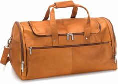 "The 22-Inch Voyager Duffel is the obvious choice for the ideal light travel bag, with its premium material, expert craftsmanship and thoughtful design. Artisan-crafted from full-grain South American Vaquetta leather, this duffel bag adds pleasure to any trip. The spacious, fully-lined main compartment is accessed via a convenient double zipper and includes an interior zip pocket for organizing your belongings. The exterior features two roomy side compartments and two additional large zipper pockets at the front and back. Carry the Voyager Duffel easily over your shoulder, or remove the adjustable strap and grab it by its two sturdy, riveted handles. No worries about damaging the bottom, either, with its protective metal feet. Choose among three rich tones of supple leather, accented with Leather Duffel Bag, Leather Duffel, Leather Weekender, Leather Travel Bag, Leather Duffle, Travel Duffle, Duffle Bag Travel, Travel Duffel, Leather Travel