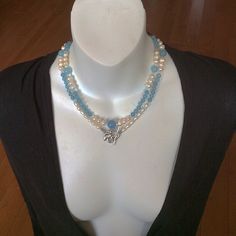 This combo style spiritual necklace handmade with round Aquamarine and Pearl beads. It will be a nice gift for sophisticated fashion and/or jewelry lover.  Our pictures show how we could wear this Blue and Pearl beautiful combo necklace.  By its metaphysical meaning, Aquamarine increases leadership abilities. Pearl is known as a nature wisdom creature. Each Pearl is unique, it absorbs and holds different inspirational thoughts, and the energy of one bead doesn't blend with the energy of another. All kinds of the natural Pearls balance and heal all chakras. Elegant Handmade Double Strand Crystal Necklaces, Elegant Handmade Double Strand Crystal Necklace, Multi-strand Pearl Necklace With Natural Stones For Gifts, Gift Multi-strand Pearl Necklace With Natural Stones, Blue Double Strand Spiritual Necklace, Double Strand Jewelry With Unique Variations As Gift, Elegant Handmade Multi-strand Crystal Necklaces, Spiritual Multi-strand Necklace With Unique Variations, Elegant Handmade Multi-strand Crystal Necklace