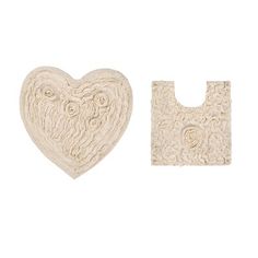 two pieces of white lace with a heart