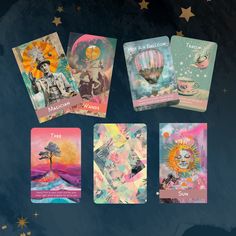 four tarot cards with images of people and hot air balloons in the sky above them