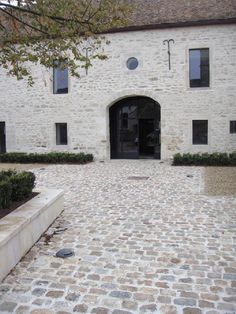 the entrance to an old stone building