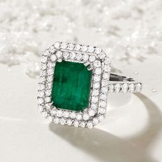 Ross-Simons - 3.00ct Emerald, 1.60ct t. w. Diamond Ring in 14kt White Gold. Size 8. An enticing 3.00 carat emerald glows within a double halo of 1.60 ct. t. w. round brilliant-cut diamonds, which also trail the 14kt white gold shank. Whether you call it a head-turner or a showstopper, this ring for sure makes a statement! 5/8" wide. Diamond and emerald ring. Emerald birthstones are the perfect gift for May birthdays. 14k White Gold Emerald Ring With Brilliant Cut, Luxury Emerald-cut Emerald Ring With Halo Design, Luxury Emerald Cut Emerald Ring With Halo Design, Green Emerald Cluster Ring In Platinum, Cluster Green Emerald Ring In Platinum, Green Platinum Emerald Ring With Cluster Shape, Platinum Cluster Emerald Ring, Gia Certified Formal Emerald Cut Emerald Ring, Gia Certified Emerald Diamond Ring, Timeless Style