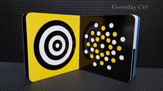 a black and yellow book with circles on it