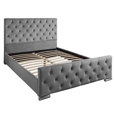 a gray bed frame with buttons on the headboard and foot board is shown in front of a white background