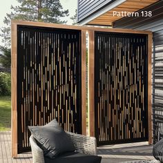 an outdoor patio with two privacy screens on the deck and one is made out of wood