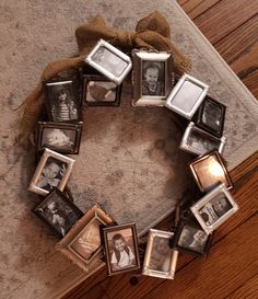 a wreath made out of old photos on the floor with a ribbon around it and some pictures in them