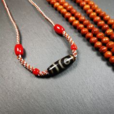 ❤This necklace was hand-woven by Tibetans from Baiyu County, the main bead is a 2 eyed dzi bead, paired with small agate beads,about 30 years old.It can be worn not only as a fashionable accessory but also holds cultural and religious significance.The length of the necklace can be adjusted, the maximum circumference is about 60cm.Dzi beads are precious jewelry from Tibetan culture which are believed to possess the power of bringing good fortune to the owners.You'll get 1pc necklace as pictures s Artisan Handmade Necklace For Blessing Occasions, Adjustable Amulet Beaded Bracelets With Round Beads, Hand-strung Amulet Beads As Gifts, Hand-strung Amulet Beads For Gifts, Handmade Amulet Beaded Necklaces With Round Beads, Handmade Adjustable Amulet Beaded Bracelets, Amulet Beaded Necklace With 108 Beads For Gift, Handmade Amulet Beads For Meditation, Handmade Amulet Beaded Necklaces For Meditation