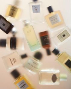 many different types of perfumes are arranged in the shape of a circle on a white surface