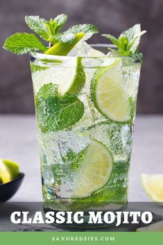 mojita with lime and mint in a glass on a gray background, close up