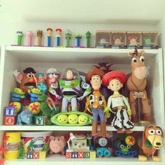 toy figurines and toys on shelves in a playroom