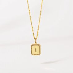 Gold Initial Pendant Necklace 18-20"– Think Goodness Gold Rectangular Pendant Name Necklace For Anniversary, Elegant Gold Initial Necklace With Monogram, Anniversary Gold Name Necklace With Rectangular Pendant, Gold Initial Necklace With Square Pendant For Anniversary, Elegant Rectangular Pendant Initial Necklace For Anniversary, Gold Square Pendant Initial Necklace For Anniversary, Luxury Personalized Gold Initial Necklace, Gold Initial Necklace With Rectangular Pendant, Gold Initial Pendant Amulet Jewelry