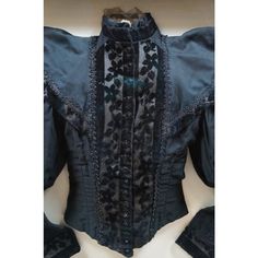 Impressive pair of circa 1890's Victorian women's dress tops. One elaborately layered black lace / mesh shirtwaist with leg og mutton / gigot sleeve. And one black bodice / jacket in cotton with floral burnt velvet accents at the cuffs, collar and placket, corded foliate detail at the cuffs, waving beaded trim and shiny black buttons. Mounted on off white fabric in contemporary carved champagne gilt shadowbox frames.  Dimensions: 30" x 4.25" x 30" (Width x Depth x Height) Historical Victorian Dress With Buttons, Fitted Victorian Historical Dress, Black Long Sleeve Victorian Dress, Victorian Long Sleeve Dress With Buttons, Black Victorian Dress With Long Sleeves, Long Sleeve Victorian Dress For Party, Fitted Victorian Dress For Costume Party, Victorian Long Sleeve Dress For Party, Victorian Fitted Blouse With Lace Collar