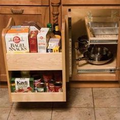 an open cabinet in the middle of a kitchen with spices and condiments on it