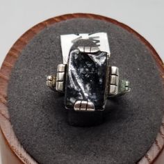 Vintage Sterling with Black Stone Ring, Size 4.5. Not marked but tested positive as Sterling. Stone is 13 x 9mm. Ring is 14mm wide. Weighs 0.13 ozt.  Are these stones real or fake? Aside from diamonds, we do not know if any gemstones are natural or synthetic. We will state on certain gemstones, that we know 100%, if they are created or fake due to their lack of inclusions. For this reason, we do not sell any diamonds without inclusions, and the larger diamonds (half ct+) are soft graded. In recent years, synthetic gemstones are being created to pass the hardness tests, which is why we state clear rubies and emeralds to be created.  In regards to Star Sapphires, typically, a genuine Star Sapphire's star will follow a light source that is shining on it, while created ones stay stationary. In Black Rectangular Stone Ring For Anniversary, Black Rings With Rectangular Stone For Anniversary, Unique Black Collectible Rings, Unique Black Rings For Collectors, Unique Black Rectangular Jewelry, 9mm Ring, European Jewelry, Black Stone Ring, Vintage Fine Jewelry